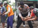 Polres Trenggalek Gelar Baksos, Gotong Royong Perbaiki Jalan Desa